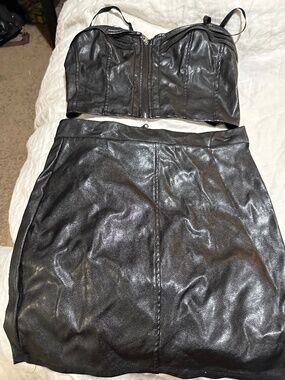 Faux leather, two pieces, top and skirt set like new without tag